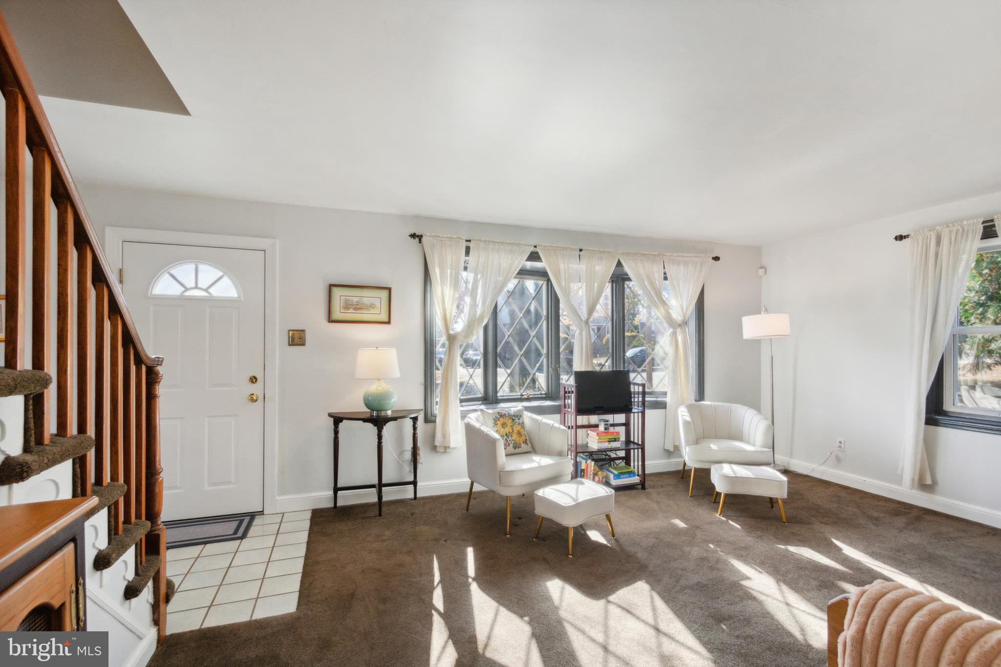 408 Barker Road Springfield, PA 19064 - Photo 6 of 22 a living room with furniture and a large window