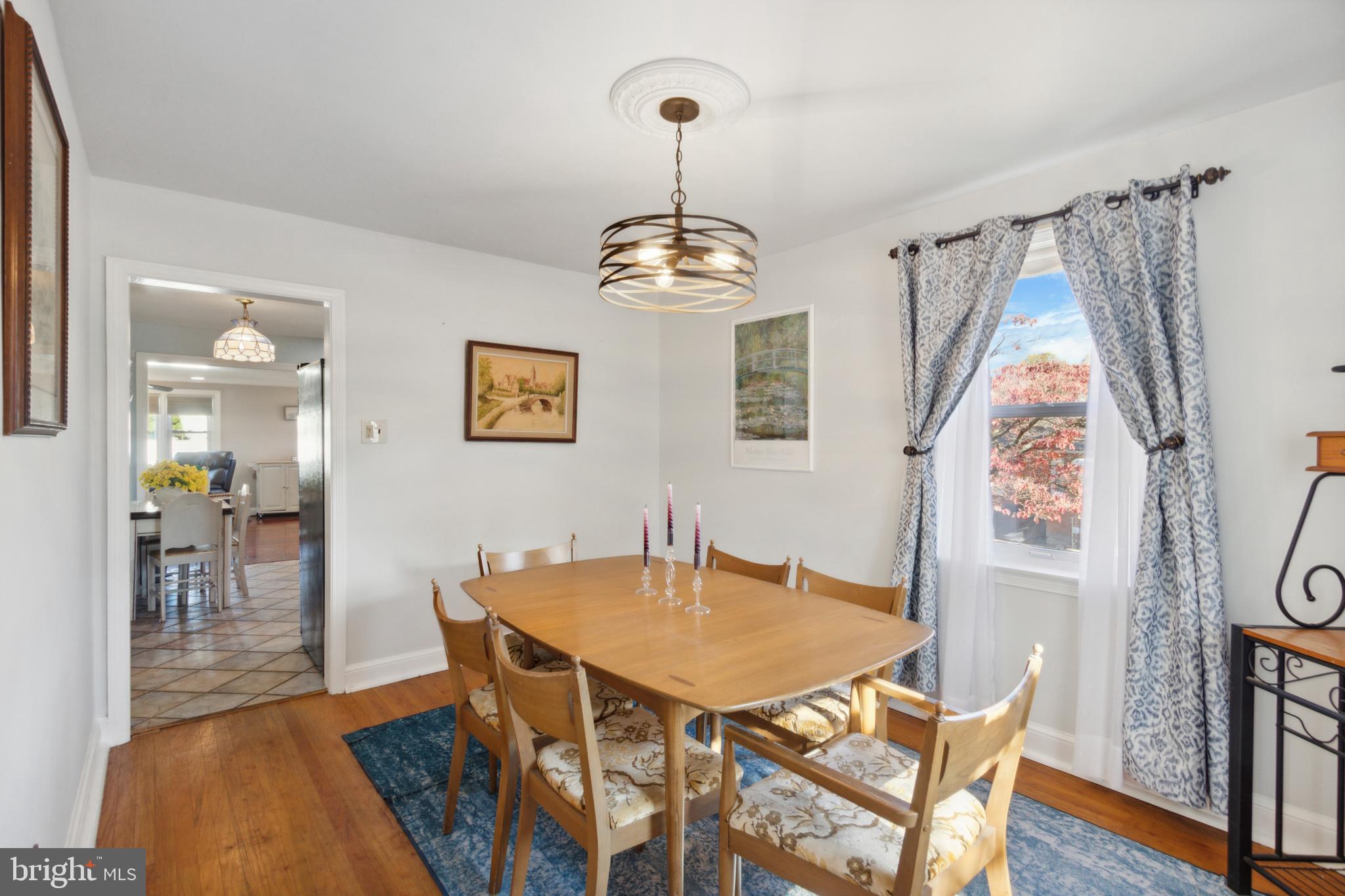 408 Barker Road Springfield, PA 19064 - Photo 10 of 22 a view of a dining room with furniture and wooden floor