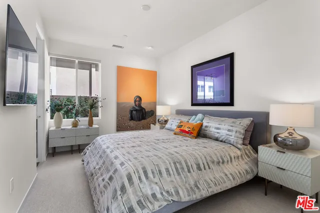 a view of a garden with a bench in patio