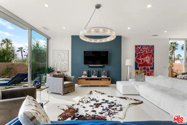 a kitchen with stainless steel appliances a sink a stove and a wooden floors