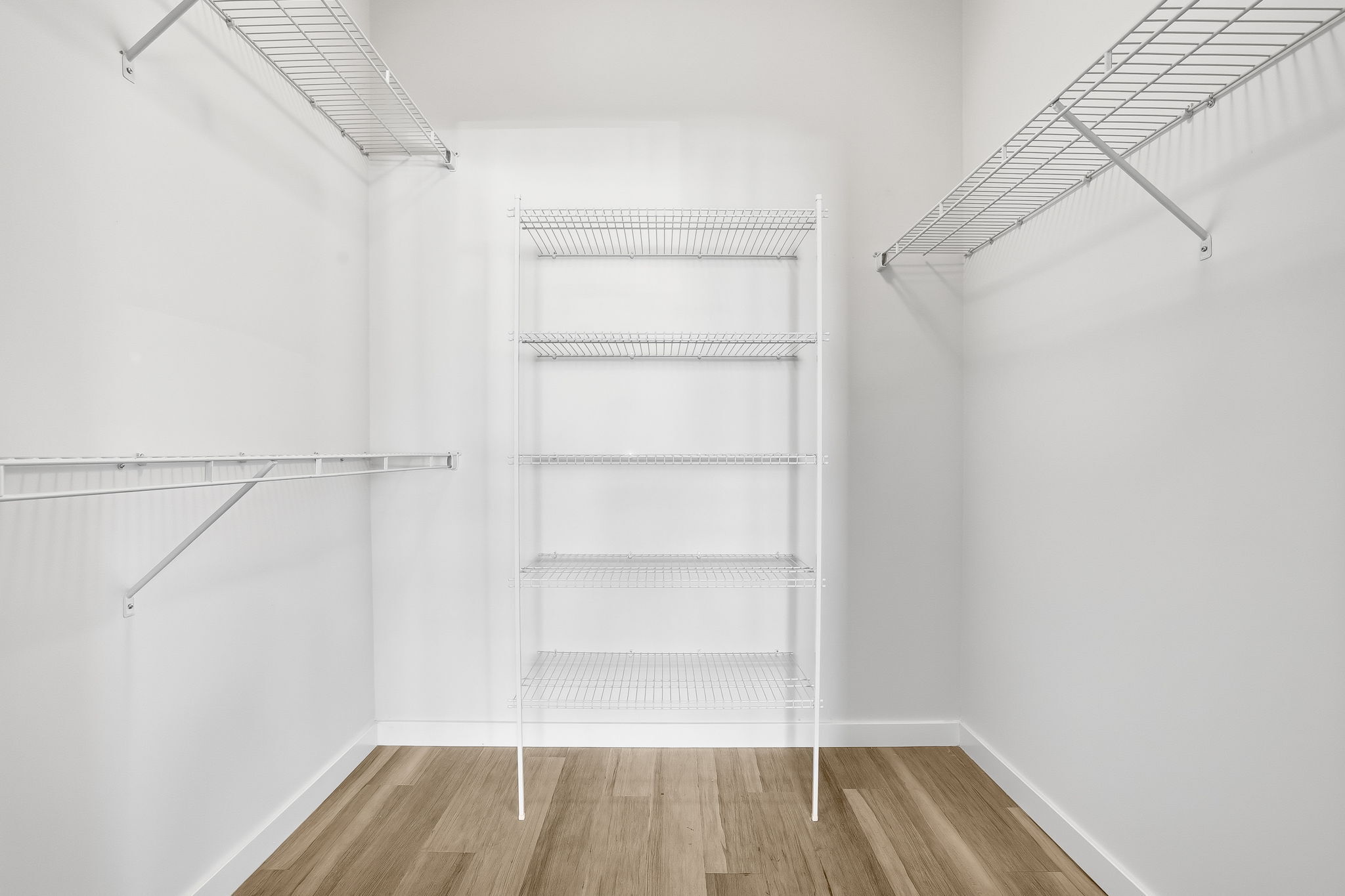 71 Connecticut Avenue, Unit 209 Norwalk, CT 06850 - Photo 16 of 25 a view of a room with racks on the wall