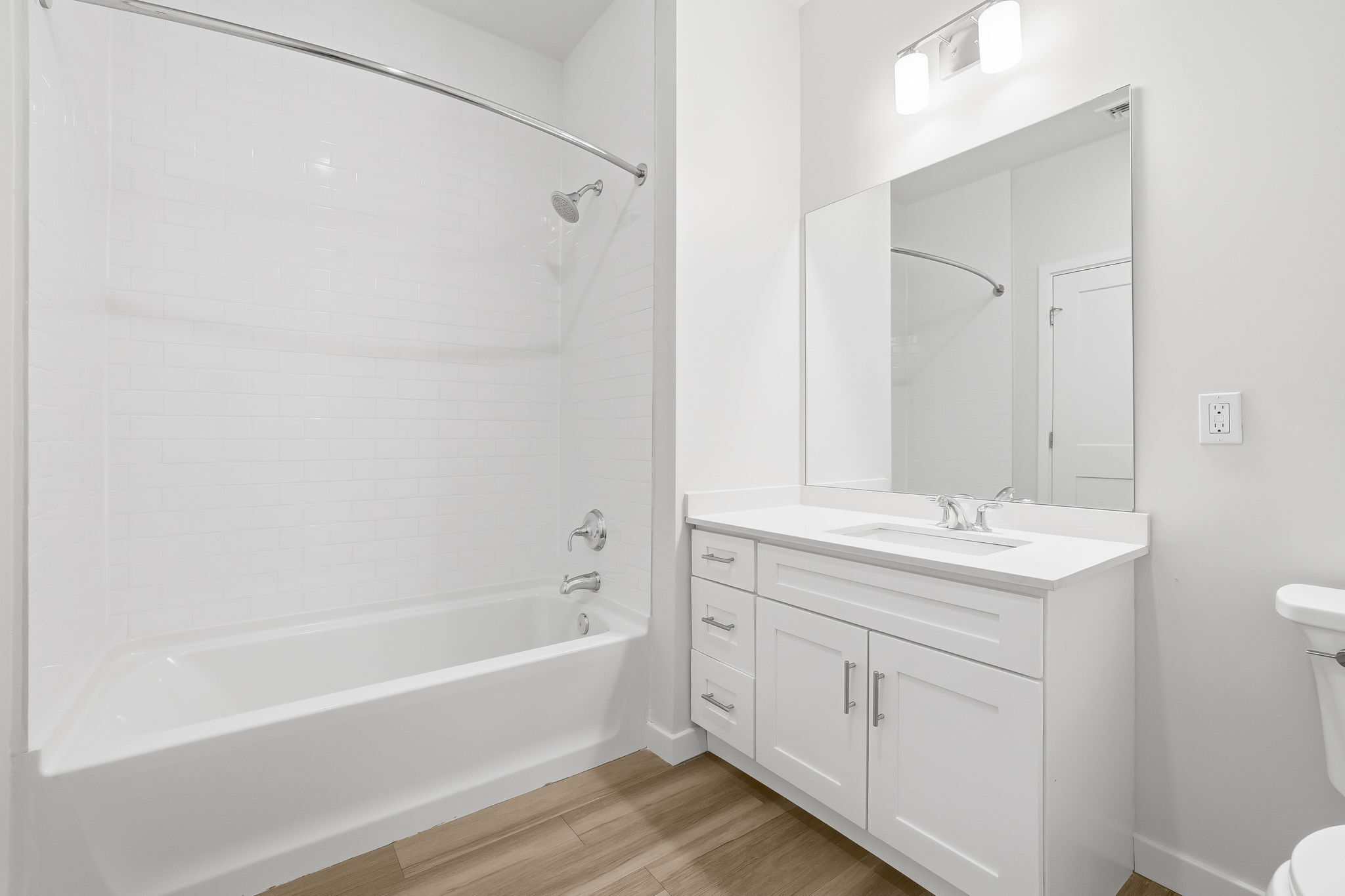 71 Connecticut Avenue, Unit 209 Norwalk, CT 06850 - Photo 21 of 25 a bathroom with a tub sink and mirror