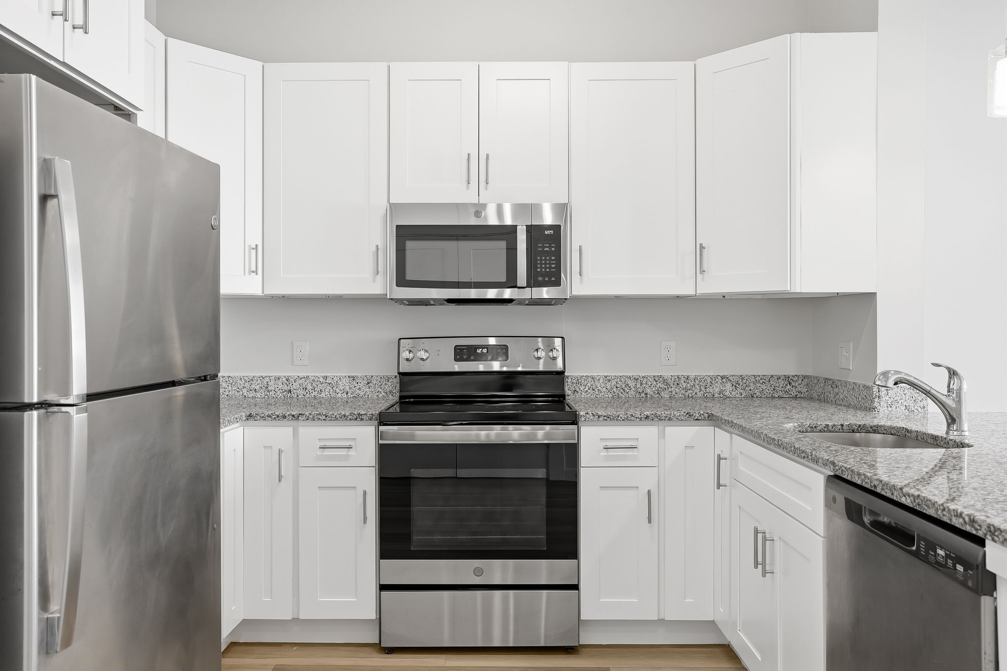 71 Connecticut Avenue, Unit 209 Norwalk, CT 06850 - Photo 9 of 25 a kitchen with cabinets stainless steel appliances and a sink
