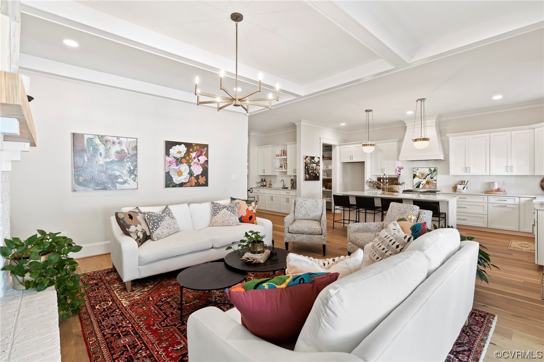 2542 Pagehurst Drive, Unit 8 Midlothian, VA 23113 - Photo 23 of 42 a living room with furniture kitchen view and a chandelier