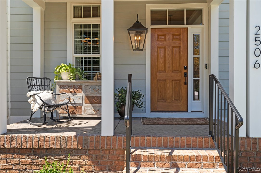 2542 Pagehurst Drive, Unit 8 Midlothian, VA 23113 - Photo 3 of 42 a front view of a house with outdoor seating