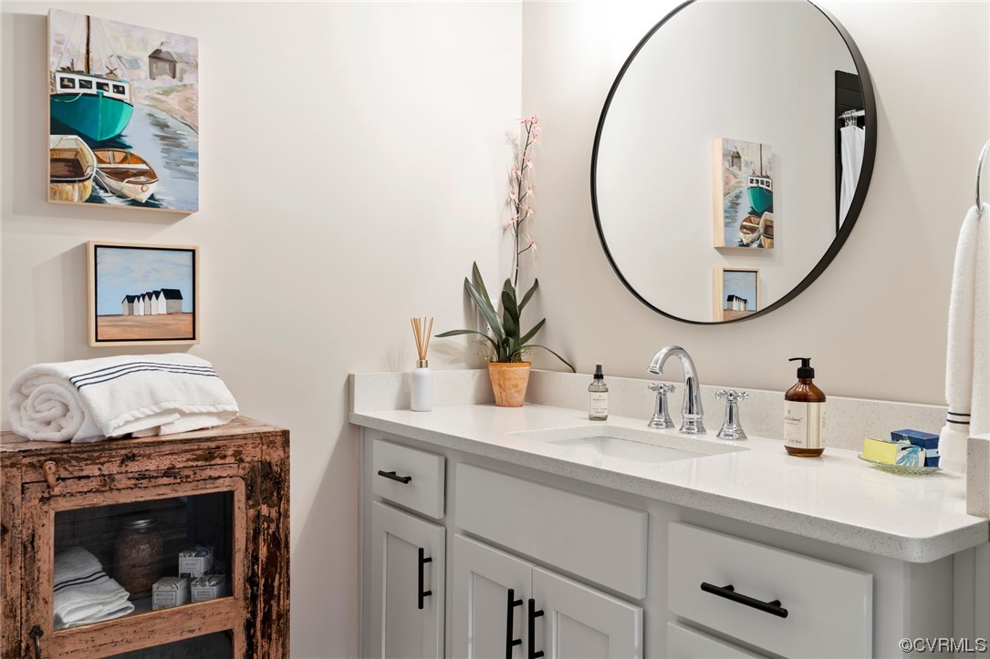 2542 Pagehurst Drive, Unit 8 Midlothian, VA 23113 - Photo 33 of 42 a bathroom with a sink and a mirror