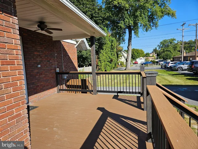 a view of a patio with a table and chairs