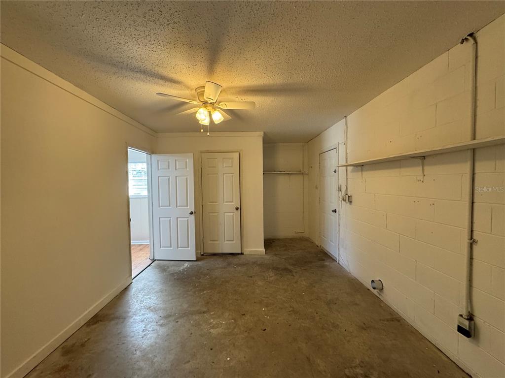 2527 Ridge Top Way Valrico, FL 33594 - Photo 22 of 29 an empty room with windows and fan