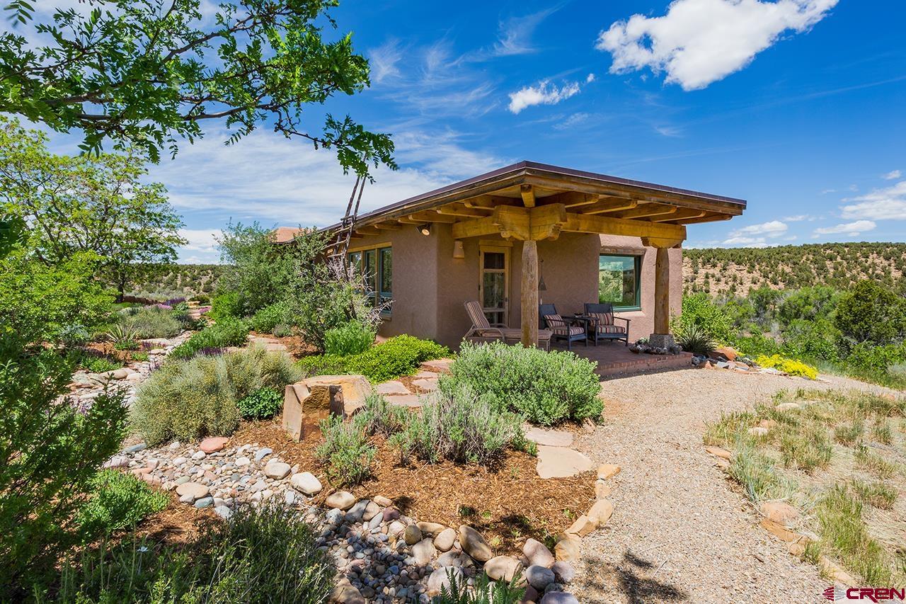 6445 County Road 100 Hesperus, CO 81326 - Photo 12 of 35 a front view of a house with a yard
