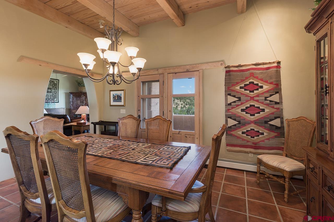 6445 County Road 100 Hesperus, CO 81326 - Photo 28 of 35 a view of a dining room with furniture and a chandelier
