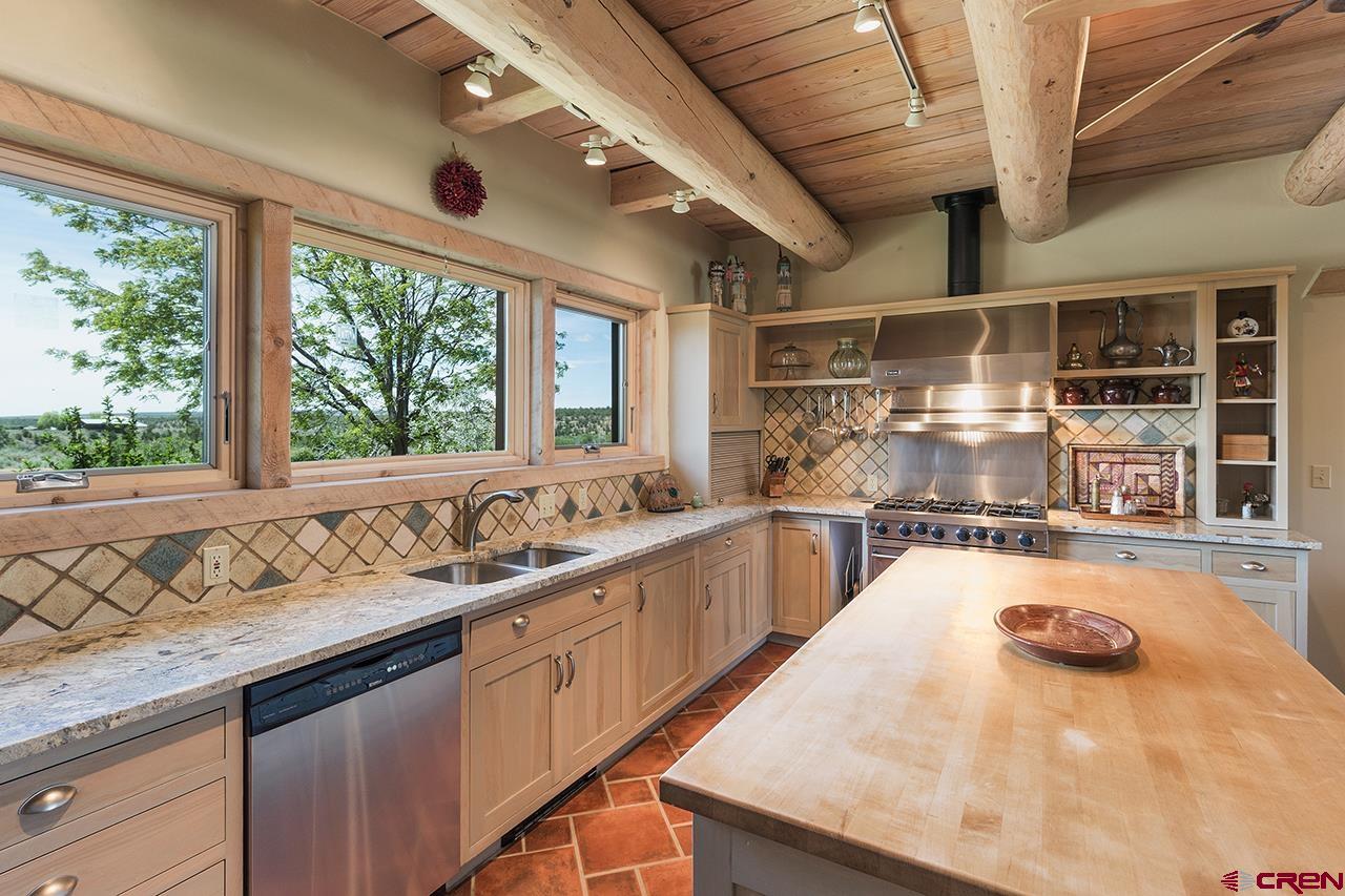 6445 County Road 100 Hesperus, CO 81326 - Photo 33 of 35 a kitchen with a sink a counter top space and stainless steel appliances