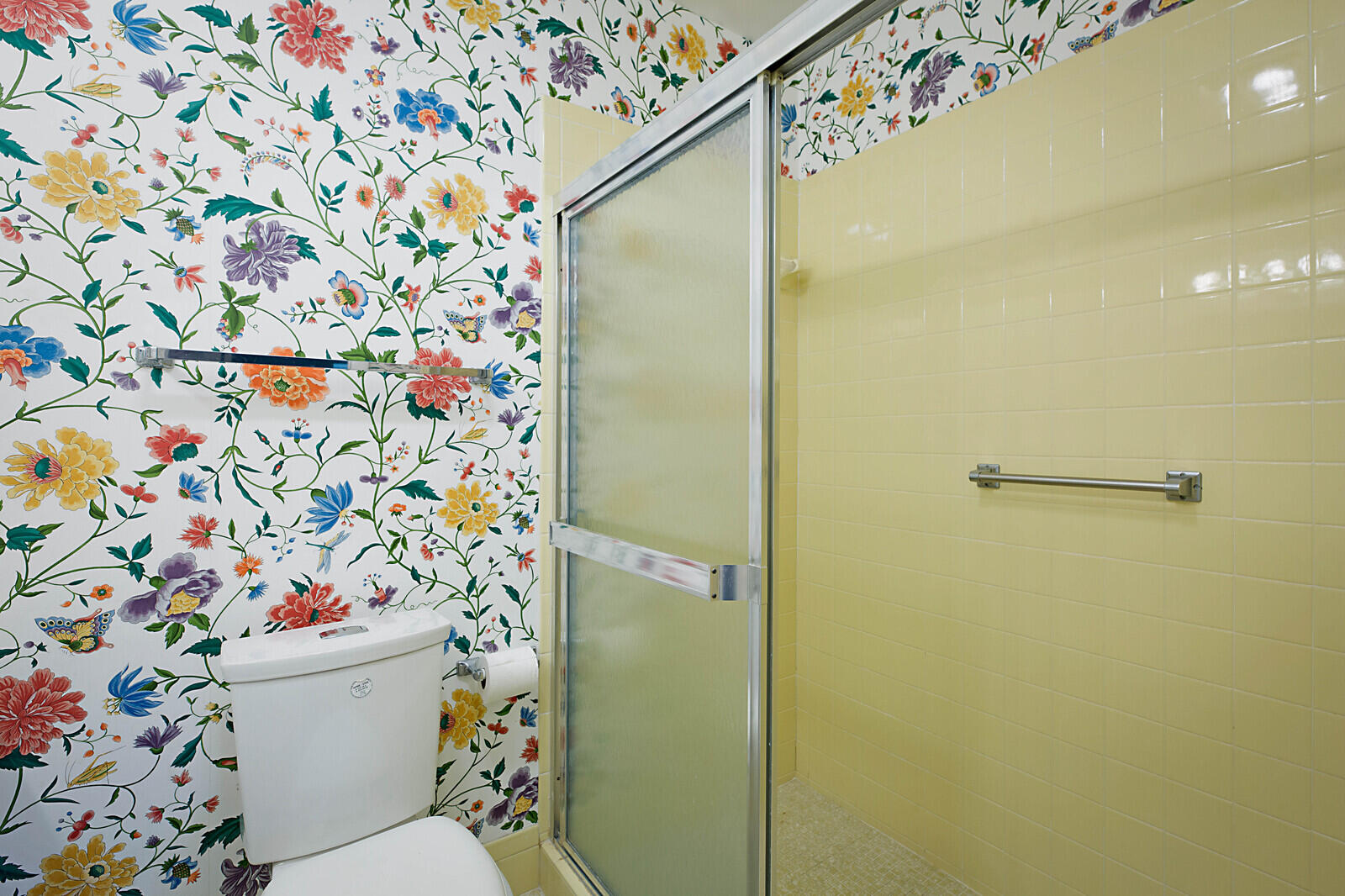4525 Northwest 3rd Street, Unit D Delray Beach, FL 33445 - Photo 17 of 25 a white toilet sitting next to a shower curtain
