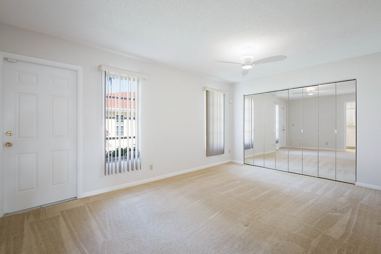 4525 Northwest 3rd Street, Unit D Delray Beach, FL 33445 - Photo 19 of 25 an empty room with windows and entrance