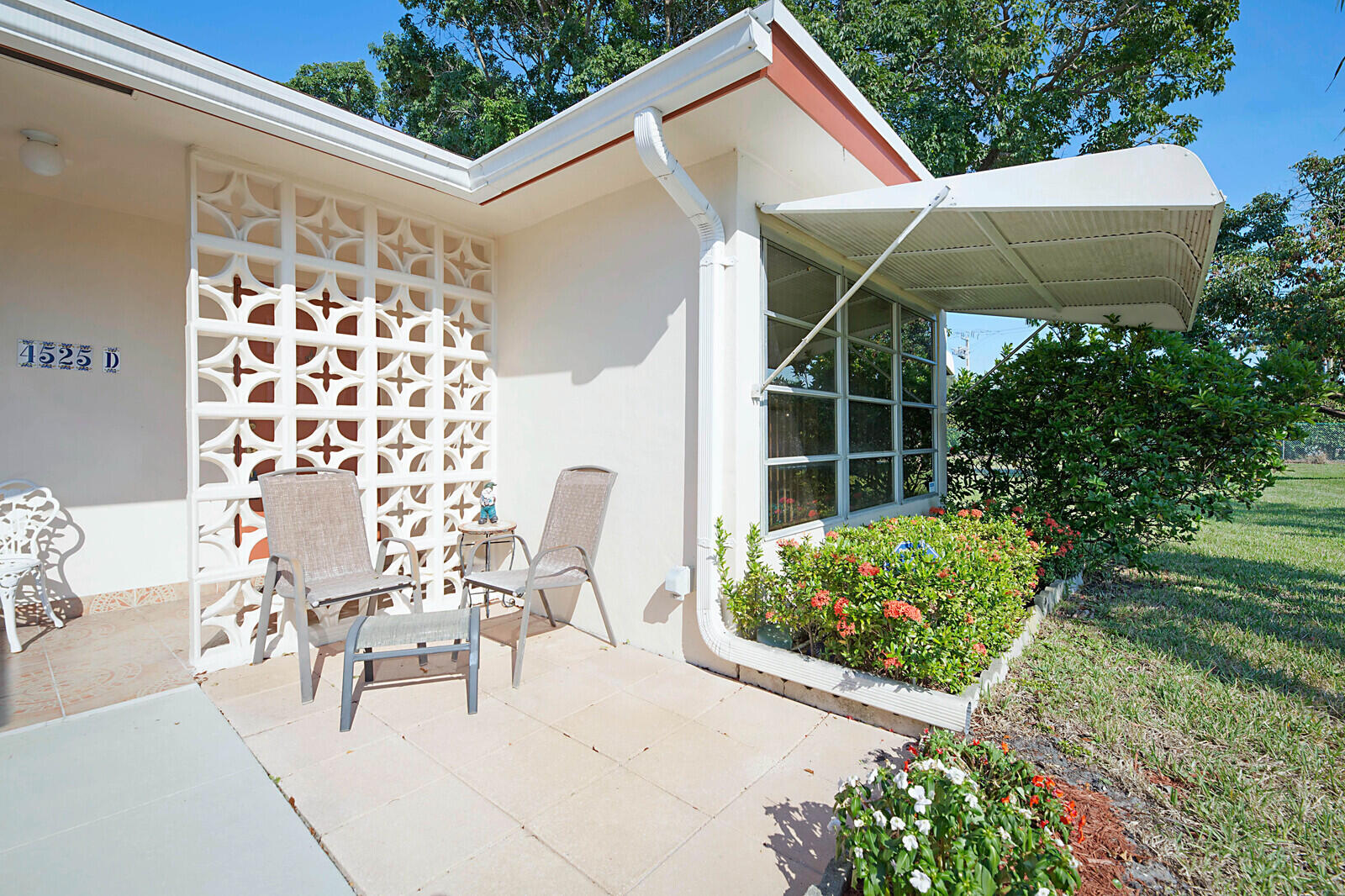 4525 Northwest 3rd Street, Unit D Delray Beach, FL 33445 - Photo 22 of 25 a view of a chair and table in backyard of the house