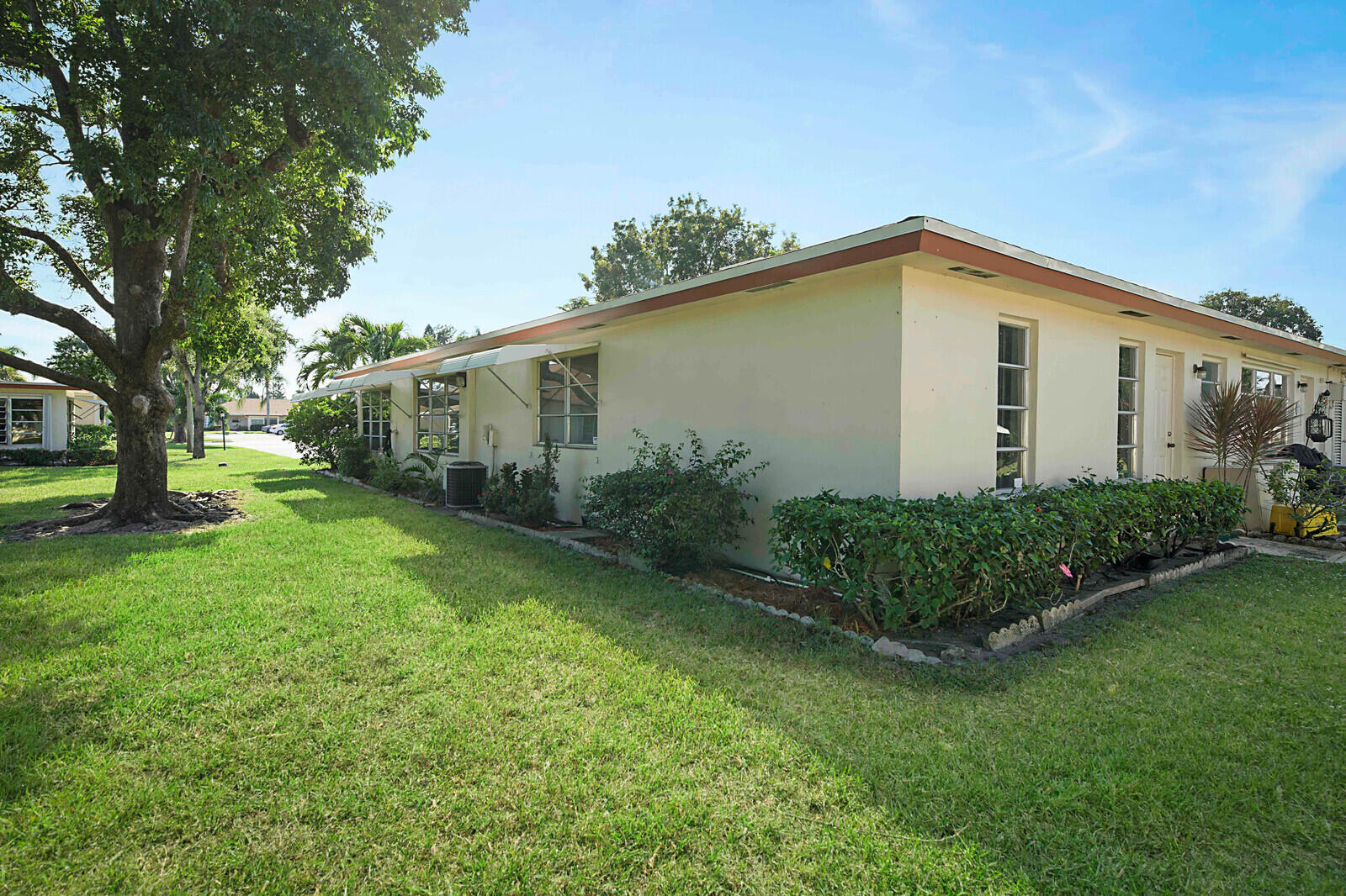 4525 Northwest 3rd Street, Unit D Delray Beach, FL 33445 - Photo 24 of 25 a view of a house with backyard and garden