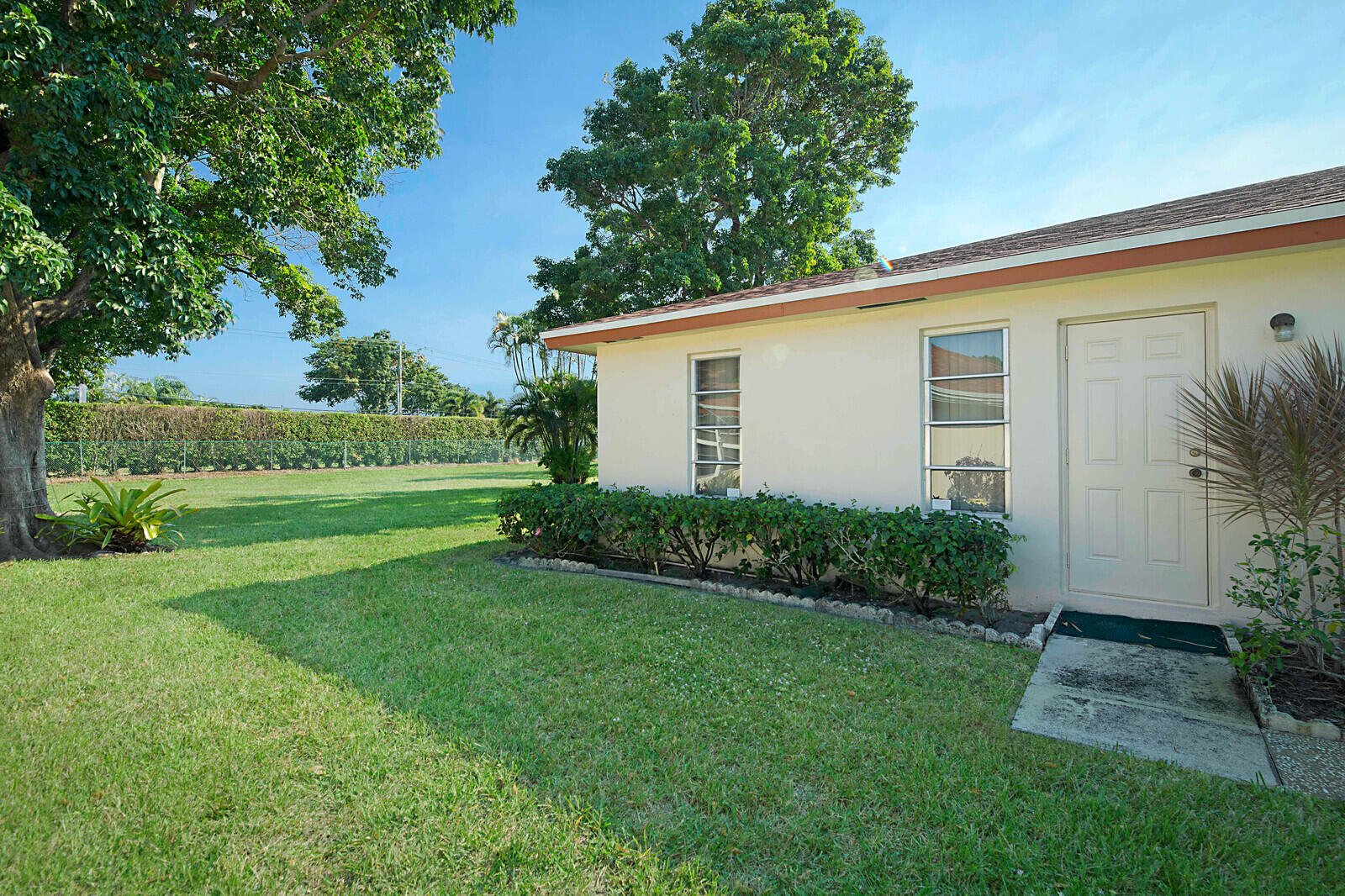 4525 Northwest 3rd Street, Unit D Delray Beach, FL 33445 - Photo 25 of 25 a view of a house with backyard and garden