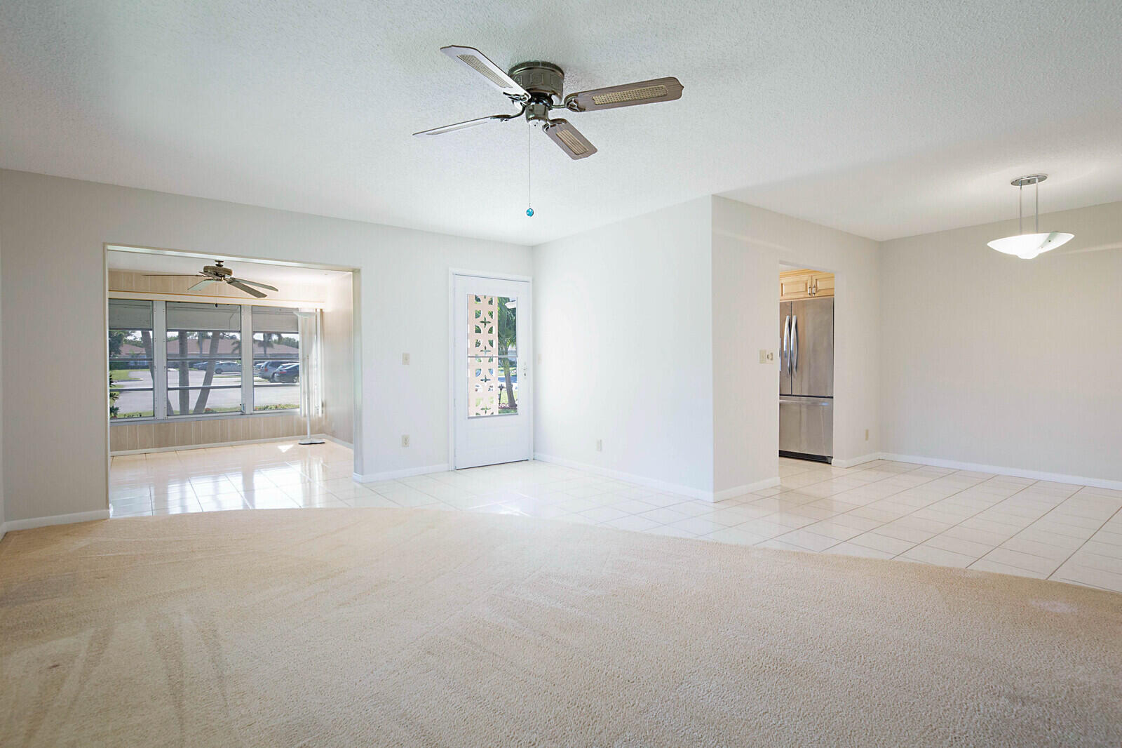 4525 Northwest 3rd Street, Unit D Delray Beach, FL 33445 - Photo 3 of 25 a view of a livingroom with a ceiling fan and window
