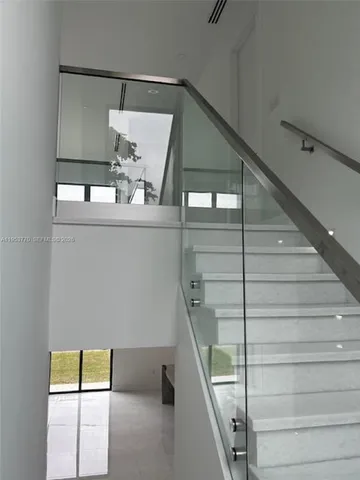 a view of entryway and kitchen