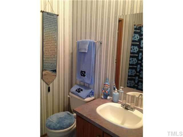 206 West O Painter Road Timberlake, NC 27583 - Photo 16 of 16 a bathroom with a sink toilet and shower