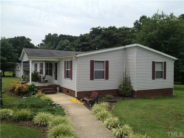 206 West O Painter Road Timberlake, NC 27583 - Photo 2 of 16 a aerial view of a house with a yard and potted plants