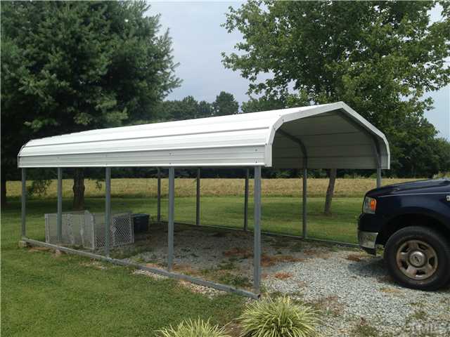 206 West O Painter Road Timberlake, NC 27583 - Photo 6 of 16 a backyard of a house with table and chairs