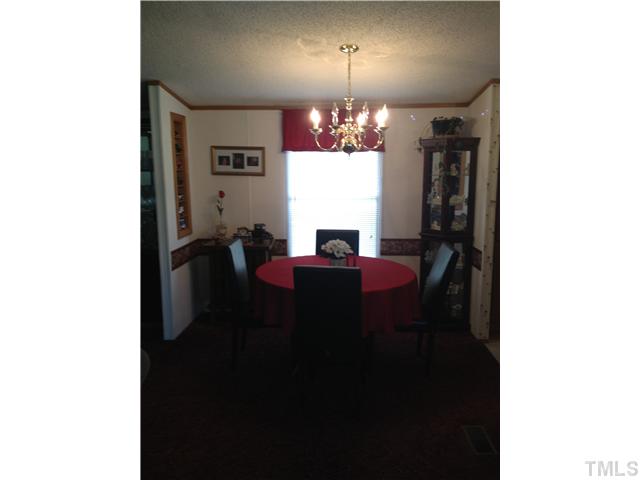 206 West O Painter Road Timberlake, NC 27583 - Photo 8 of 16 a view of a dining room with a table and chairs