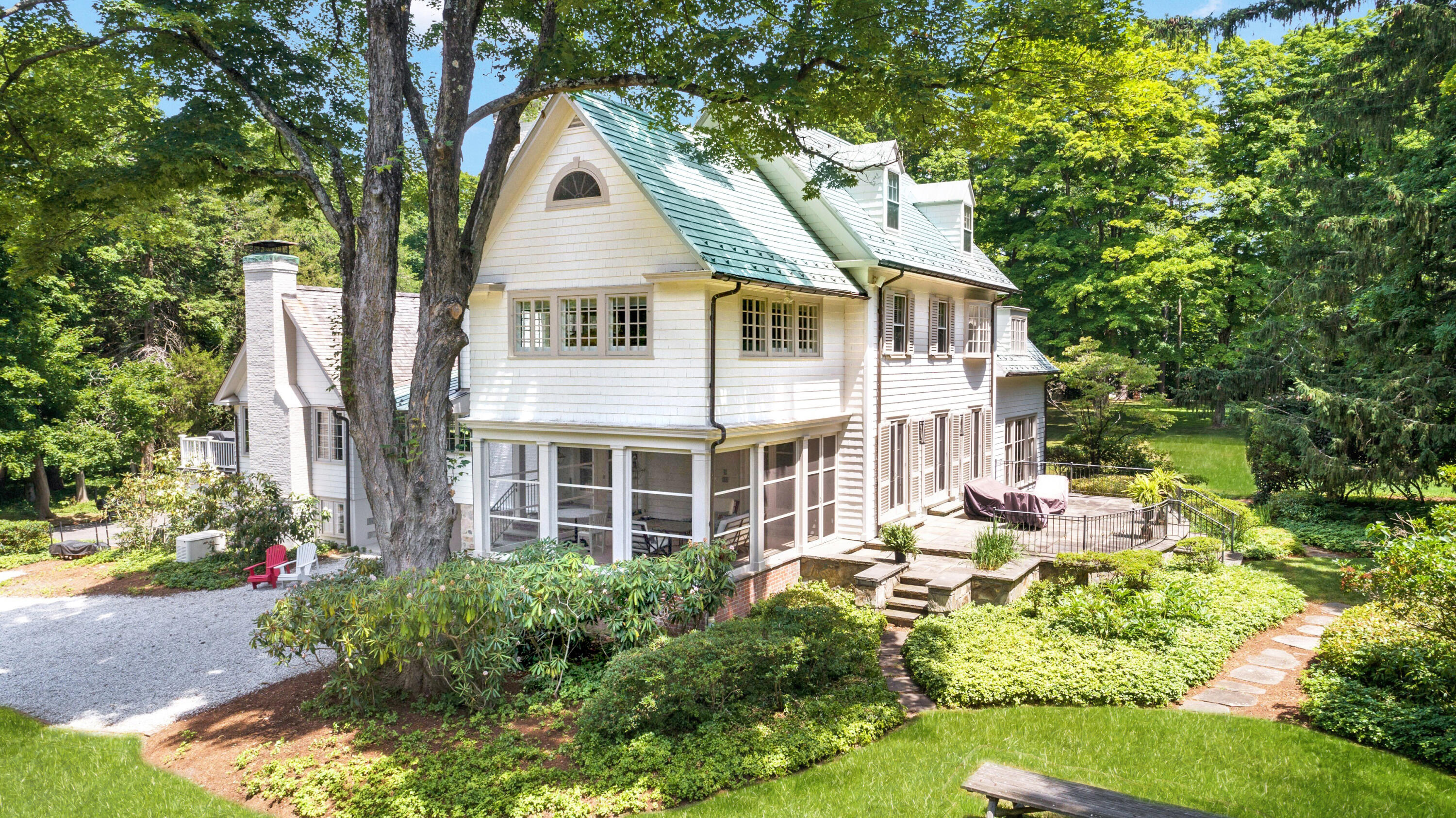343-335 Wahackme Road New Canaan, CT 06840 - Photo 25 of 32 a view of a house with a yard and potted plants