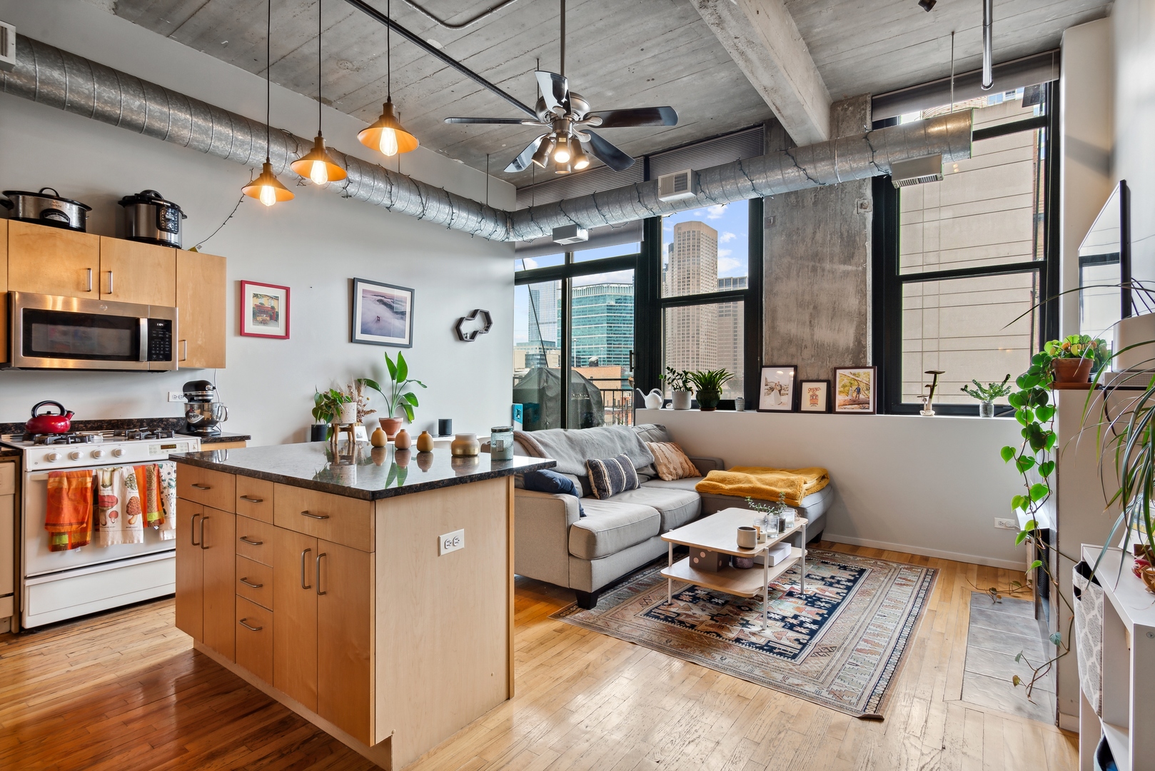 843 West Adams Street, Unit 405 Chicago, IL 60607 - Photo 2 of 12 a living room with furniture and a flat screen tv