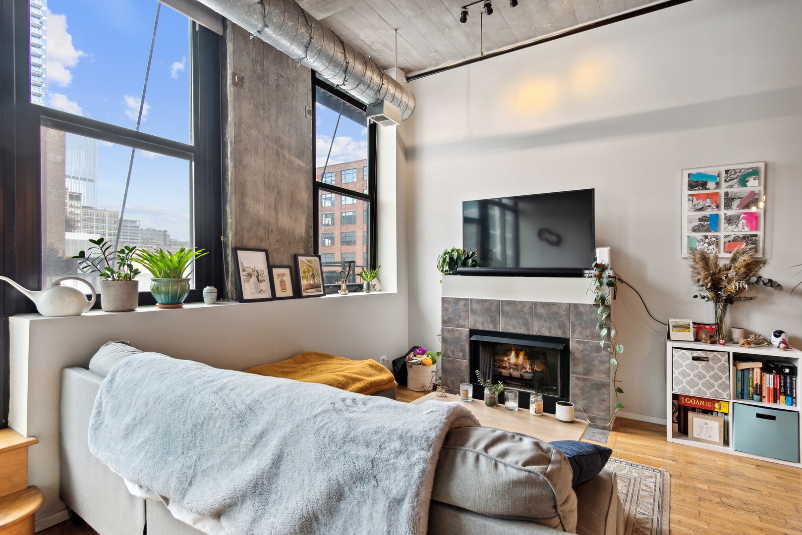 843 West Adams Street, Unit 405 Chicago, IL 60607 - Photo 6 of 12 a living room with furniture and a fireplace