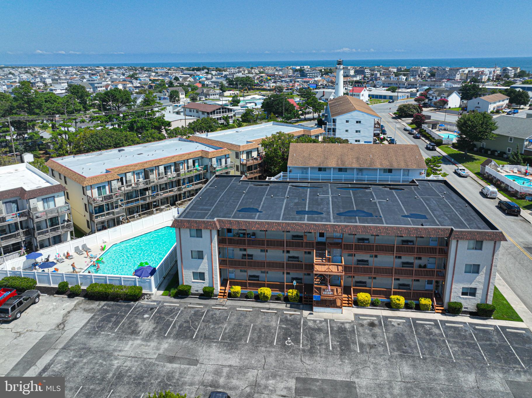14405 Tunnel Avenue, Unit 112 Ocean City, MD 21842 - Photo 15 of 32 an aerial view of a house with a garden potted plants and large buildings