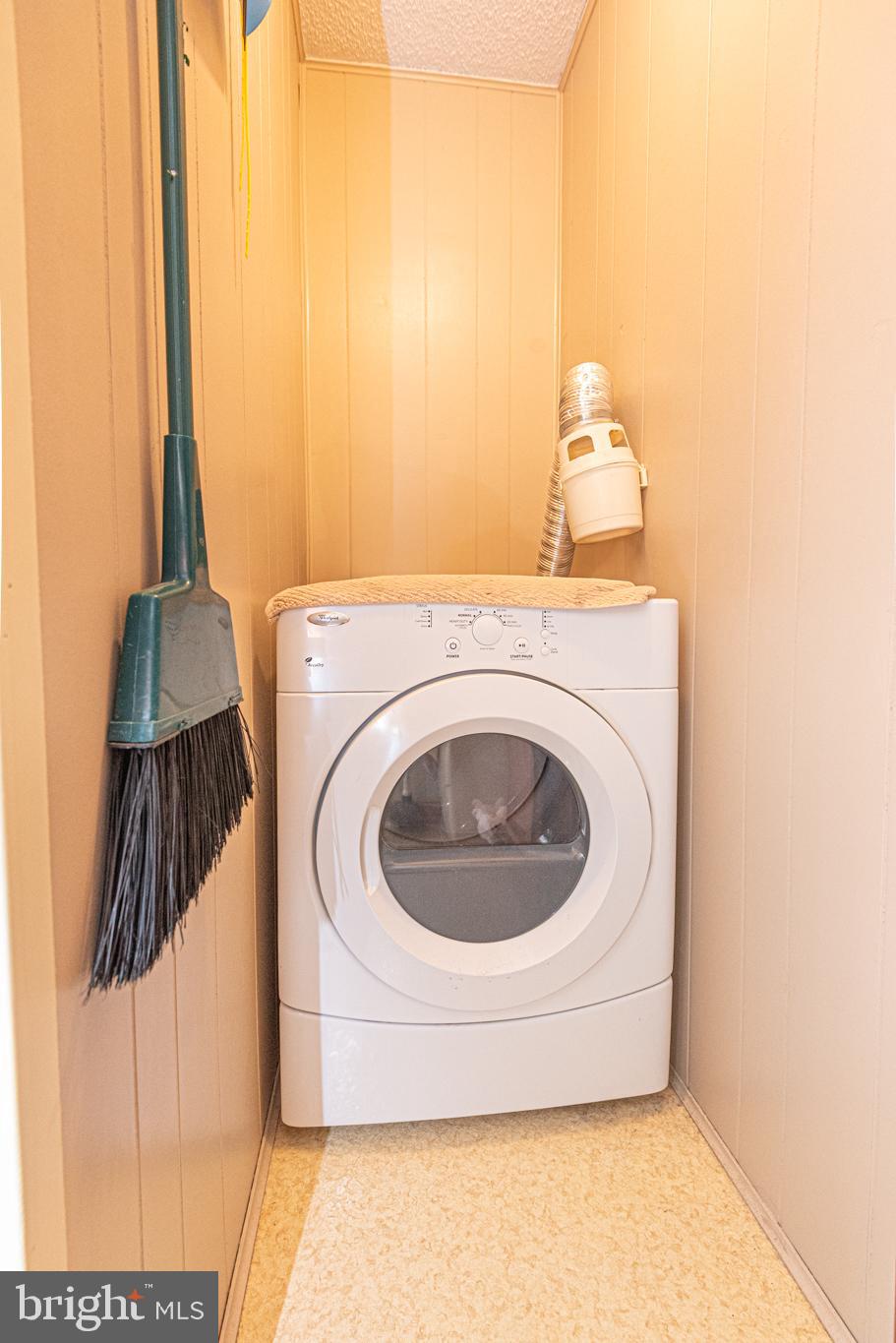 14405 Tunnel Avenue, Unit 112 Ocean City, MD 21842 - Photo 29 of 32 a utility room with dryer and washer