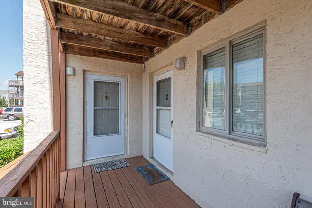 a view of hallway with wooden floor