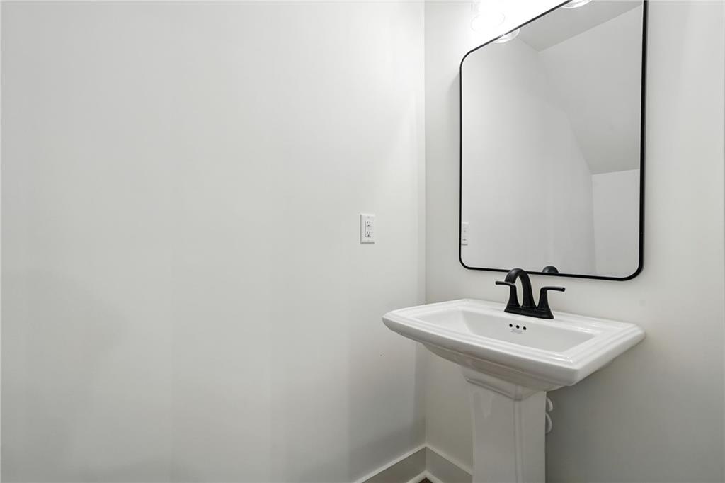 133 Old Alabama Road Southeast Emerson, GA 30137 - Photo 13 of 40 a bathroom with a sink and a mirror