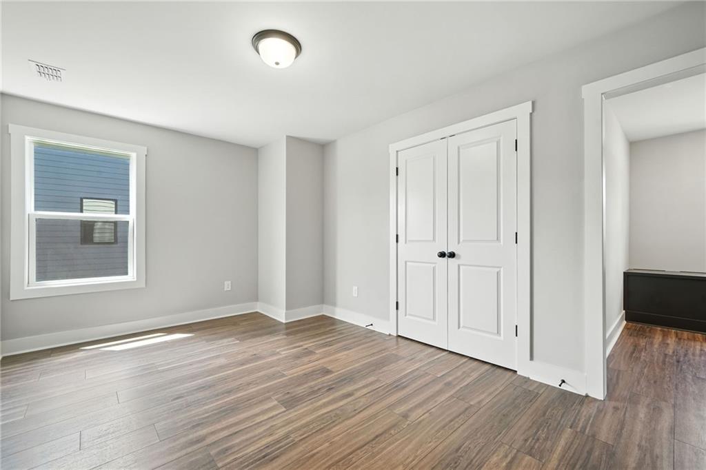 133 Old Alabama Road Southeast Emerson, GA 30137 - Photo 20 of 40 a view of an empty room with wooden floor and a window