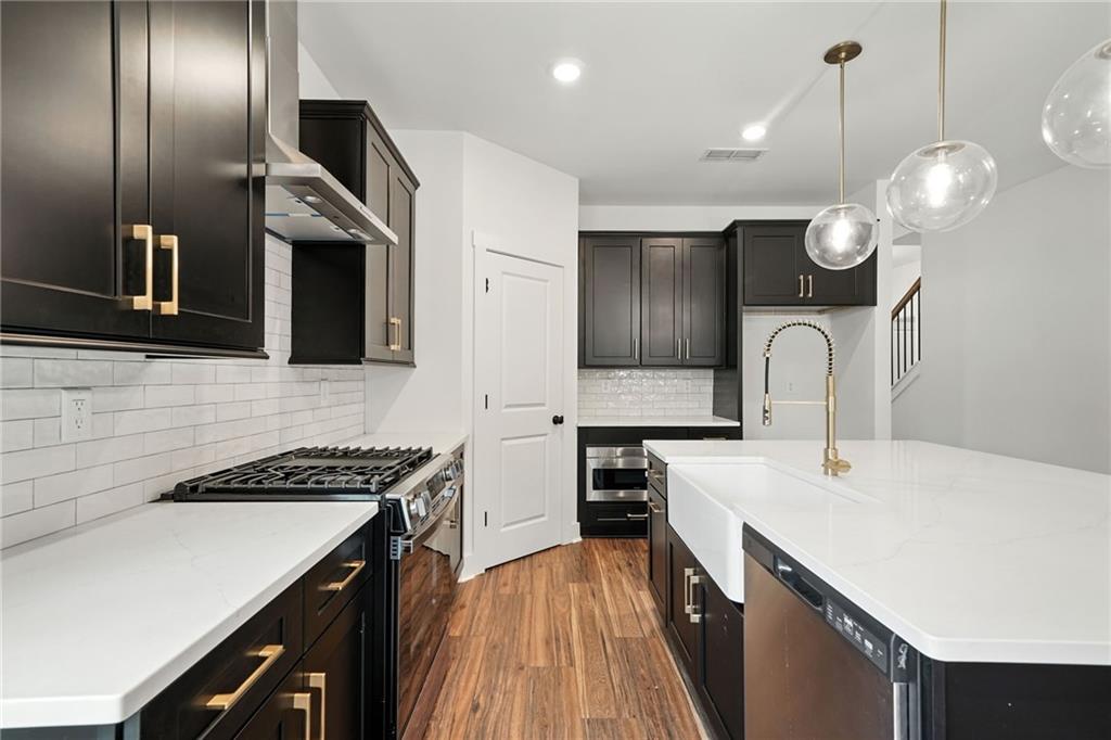 133 Old Alabama Road Southeast Emerson, GA 30137 - Photo 5 of 40 a kitchen with cabinets and steel stainless steel appliances
