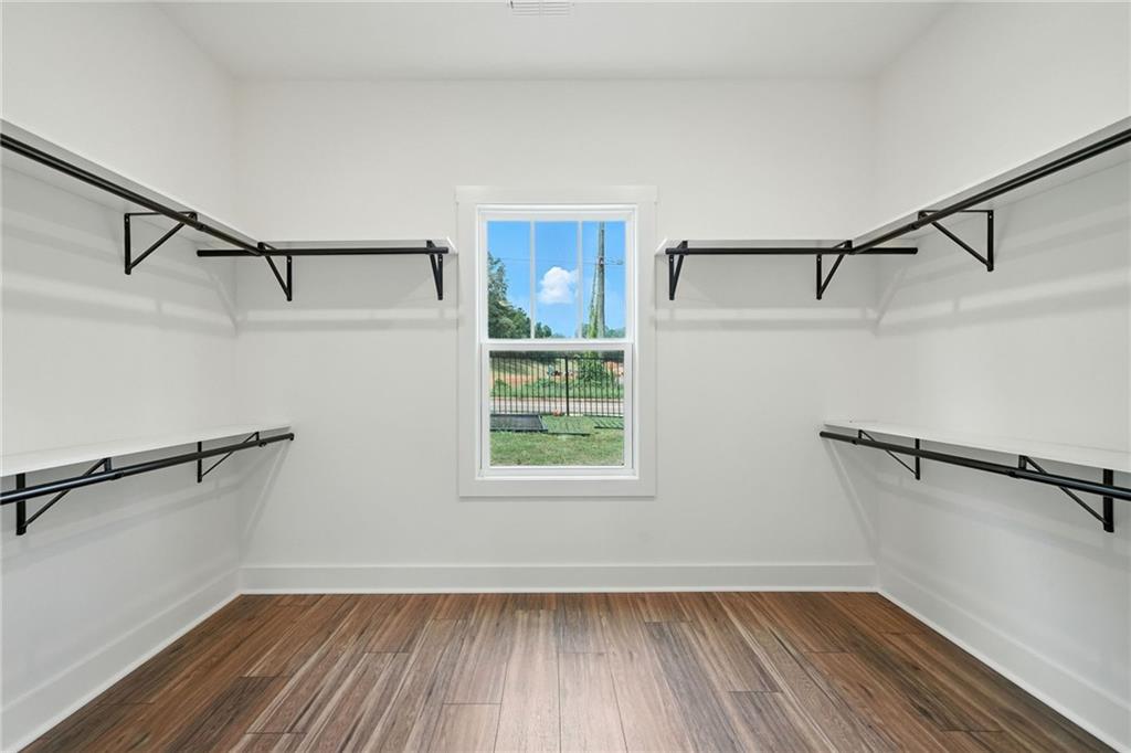 133 Old Alabama Road Southeast Emerson, GA 30137 - Photo 8 of 40 a view of a room with wooden floors and a window