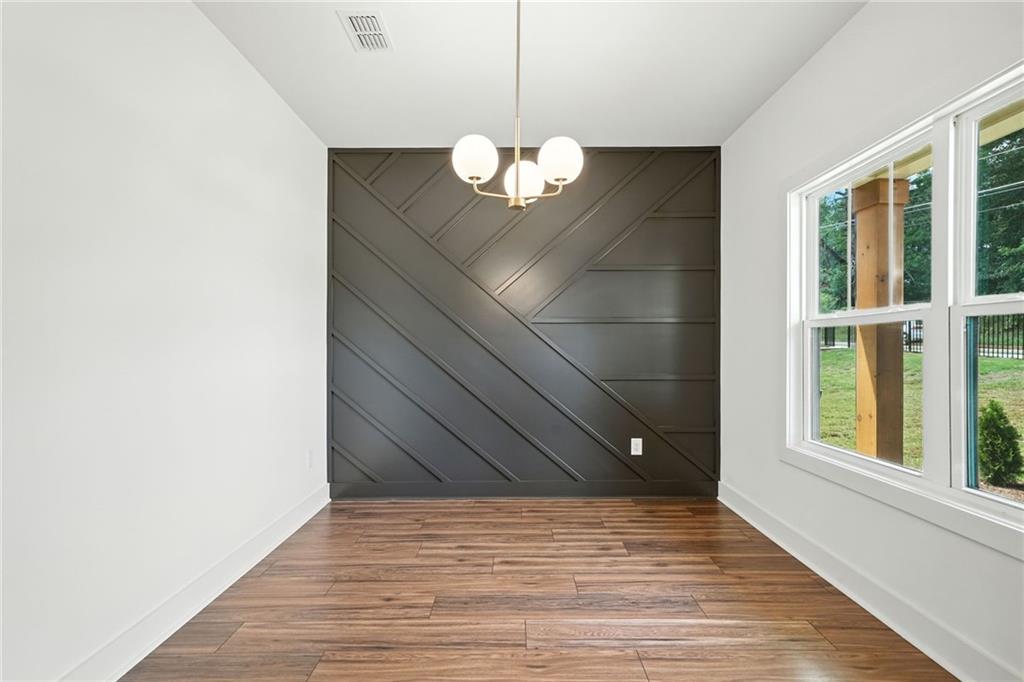 133 Old Alabama Road Southeast Emerson, GA 30137 - Photo 9 of 40 a view of an empty room with wooden floor and a window