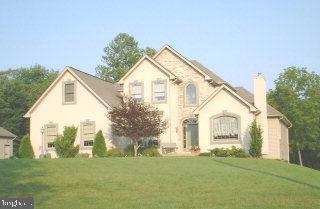 1523 Brunnerville Road Lititz, PA 17543 - Photo 1 of 10 a view of a white house next to a yard with big trees