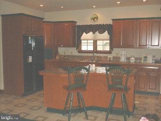 1523 Brunnerville Road Lititz, PA 17543 - Photo 5 of 10 a kitchen with stainless steel appliances granite countertop a stove a sink and a microwave