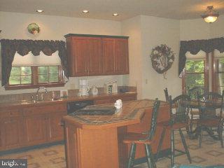 1523 Brunnerville Road Lititz, PA 17543 - Photo 6 of 10 a kitchen with a dining table and chairs