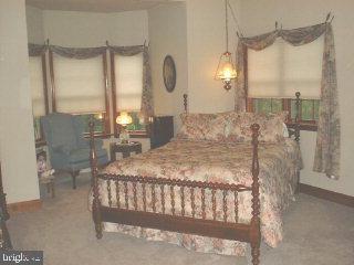 1523 Brunnerville Road Lititz, PA 17543 - Photo 8 of 10 a bed sitting in a room next to a window