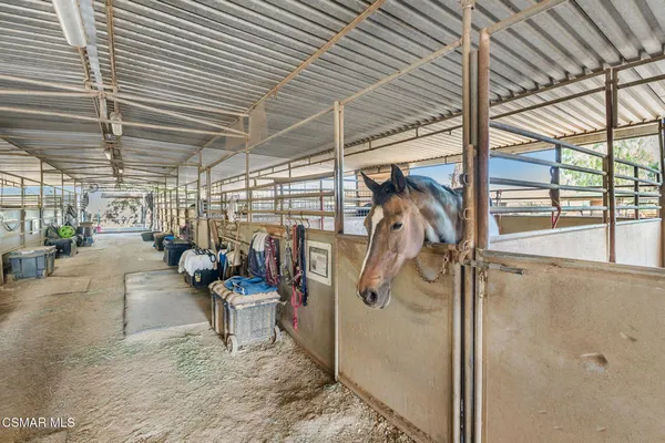 a view of a bike storage roof and parking