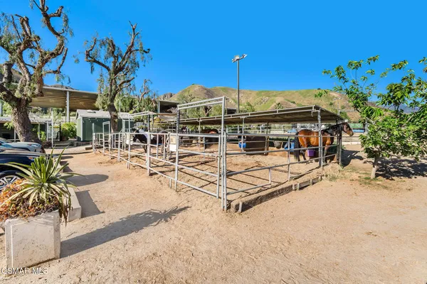 a view of an outdoor space and basketball court