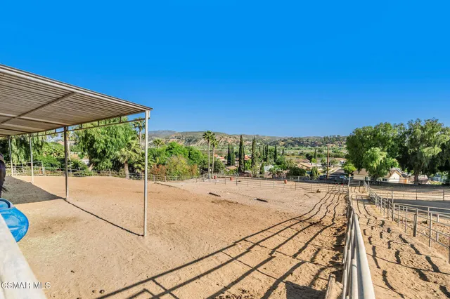 a view of a patio with table and chairs