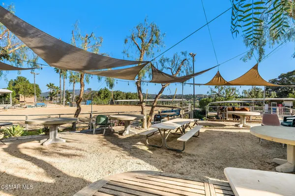 a view of a street with a building and a car parked in front of it