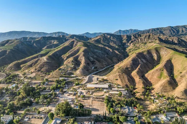 a view of a town with mountains in the background
