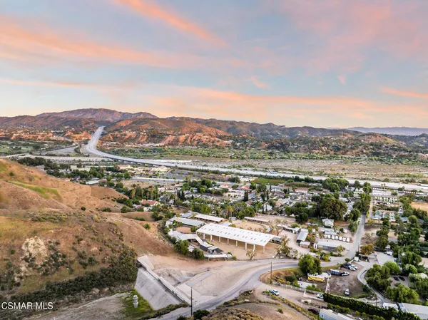 an aerial view of residential house and parking space