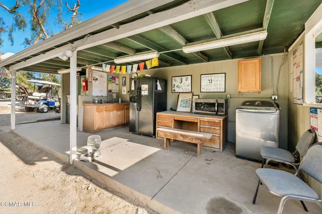 a view of a chairs and table in a patio