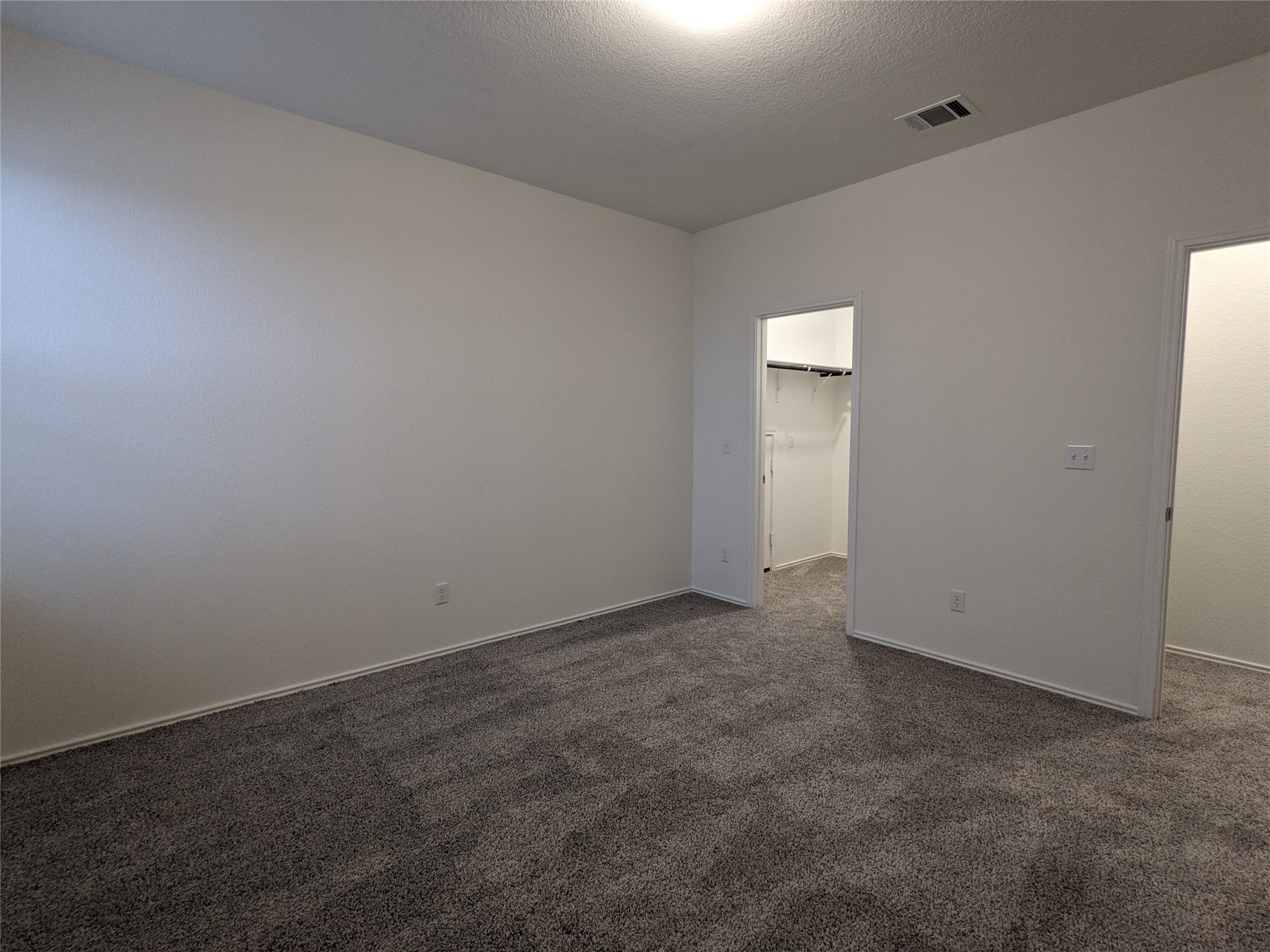 100 Montauk Loop Georgetown, TX 78628 - Photo 11 of 21 Ample space for personal retreat, complete with comfortable carpeting and convenient closet access.