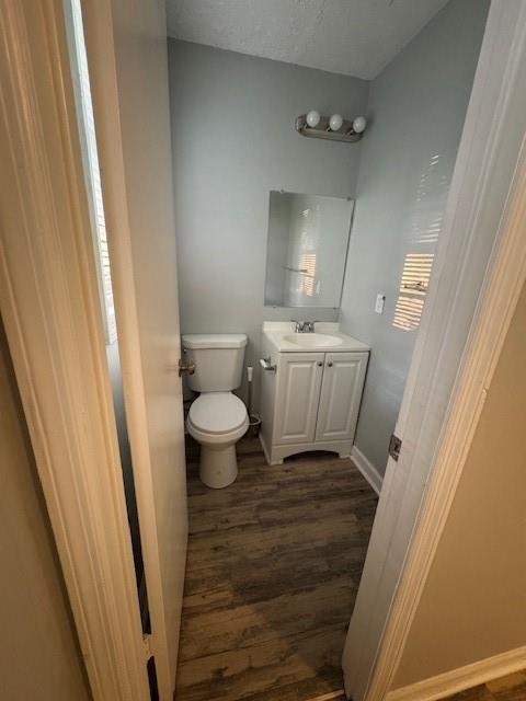 8327 Glenwoods Terrace, Unit A Riverdale, GA 30274 - Photo 2 of 9 a bathroom with a sink a toilet a mirror and vanity